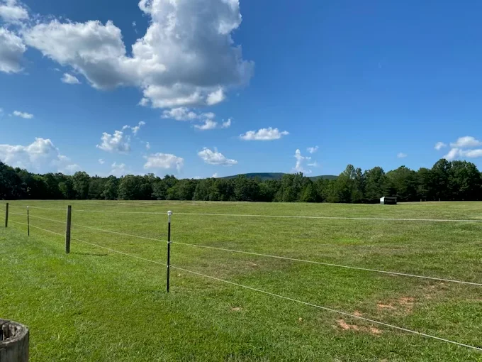 Large field mowing and maintenance in Virginia countryside